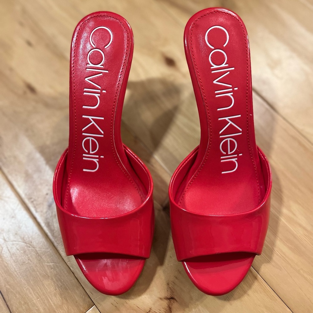 Red patent leather CK peep toe heels